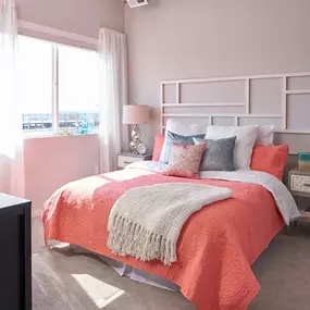 Furnished bedroom with large window