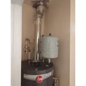 Water heater with water softener attachment.