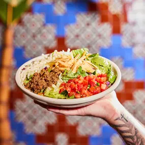 Taco Salad - Fresh salad mix with tortilla strips, cheese, guacamole, tomatoes & your choice of fajita chicken, fajita beef or seasoned ground beef.