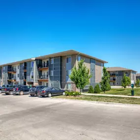 Apartment building with surface parking lots