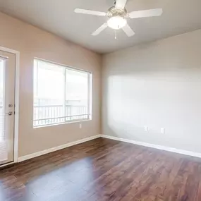 Room with balcony access and ceiling fan
