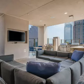rooftop lounge at Atlantic House Midtown, offering a luxurious outdoor space with plush sectional seating