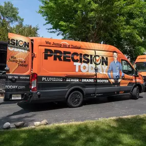 Precision Today Plumbing Heating Cooling Electrical vans outside