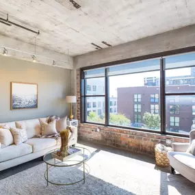 Furnished living room with large windows