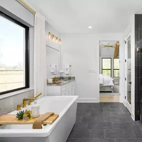Luxurious primary bathroom with an oversized shower and soaking tub
