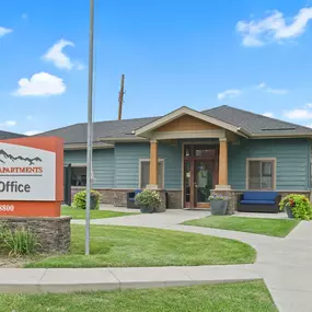 A leasing office for Mountain Vista Apartments is shown with a sign in front of the building.