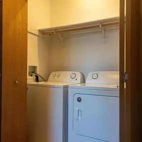 a laundry room with a washer and dryer in it