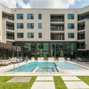 resort-style living at The Anderson, where a stunning courtyard pool, spa, and stylish lounge areas create the perfect retreat.