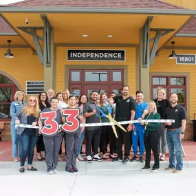 The Dental Depot Independence team takes a photo of the ribbon cutting ceremony.