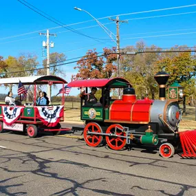 Dental Depot's train going down the road in a parade.