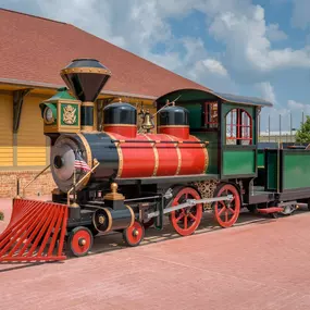 A view of the model train on a sunny day at Dental Depot's West Oklahoma City dental clinic