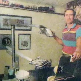 Dr. Glenn, founder of Dental Depot, poses in the original dental depot office when he first started.