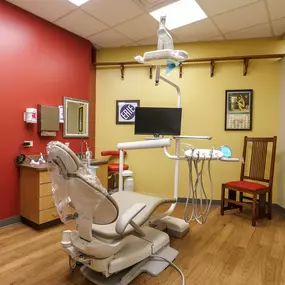 Dental operatory at Dental Depot's NW 63rd St Oklahoma City Dental office with dental chair and train themed pictures.
