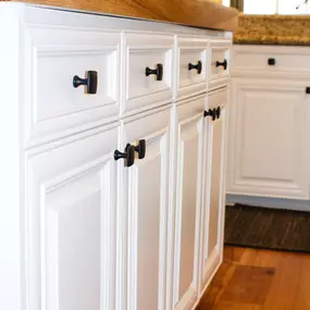 white painted cabinets and drawers