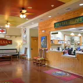 Central Tulsa's dental clinic waiting room and reception area with train themed signage