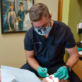 Dr. Kooken examines a dental patient.