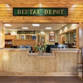 Tulsa Hills dental clinic waiting room and reception area with train themed signage and natural wood panels