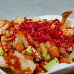Papas locas, homemade fries with Japanese peanuts, cucumber, escuincles, lime, pork rinds, soy sauce, and Valentina sauce.
Papas locas, papas caseras con cacahuate japonés, pepino, escuincles, limón, cueritos, salsa de soya y Valentina.