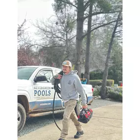 Our tech grabbing tools from the truck, ready to knock out a filter cleaning and keep the pool running strong.