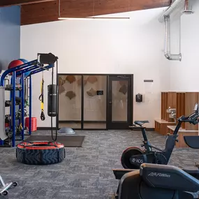 a gym with cardio machines and other exercise equipment