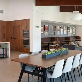 a dining room and living room with a table and chairs
