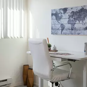 a desk with a chair in a home office