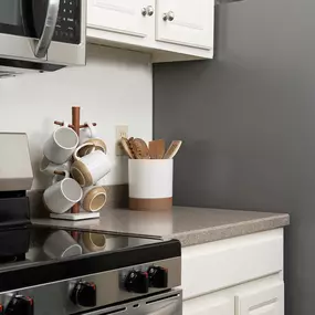 a kitchen with a stove and a refrigerator