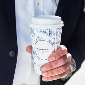 man holding coffee cup