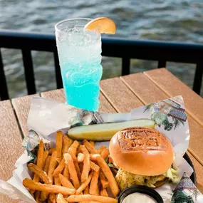 Our Signature burger served with fries and a cup of our Joe's Juice on the outdoor deck!