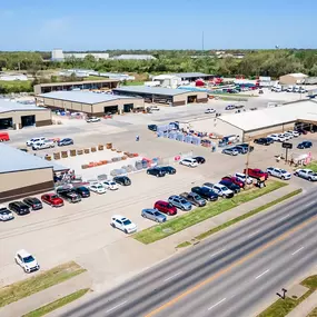 Aerial view of Cleaver Farm & Home’s 15-acre retail and wholesale campus in Chanute, Kansas. The photo showcases multiple large warehouse-style buildings, outdoor inventory yards, customer parking, and the main ACE Hardware storefront along Highway 169. As a third-generation business, Cleaver Farm & Home offers a wide selection of hardware, lumber, farm supply, and home improvement materials, proudly serving Southeast Kansas with small-town values and big-store variety.