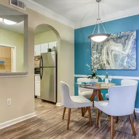 A modern dining area at Grande Club Apartments with a sleek and stylish design.