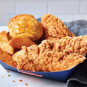 Enjoy a hearty combo of fried chicken tenders, seasoned wedges, and a honey-drizzled biscuit—all served in a convenient tray for meals on the move.