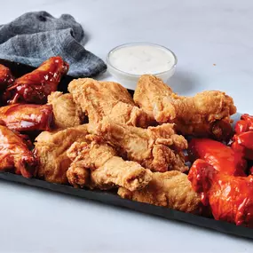 From BBQ to Buffalo to classic fried, our chicken wings platter has something for every flavor lover. Served with dipping sauce for the perfect bite.