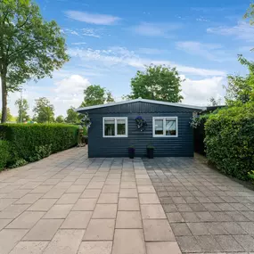 Bild von Heerlijk Houten Chalet in het Twentse met tuin - Belvilla by Oyo