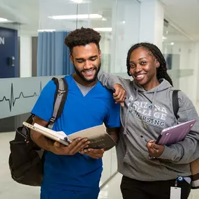 Nursing program students in hallway at Arizona College of Nursing.