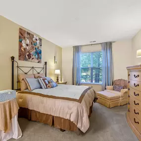 Bedroom with cozy bed and cabinets