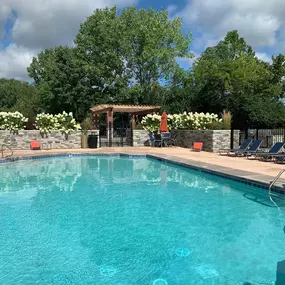 Large swimming pool with chairs around
