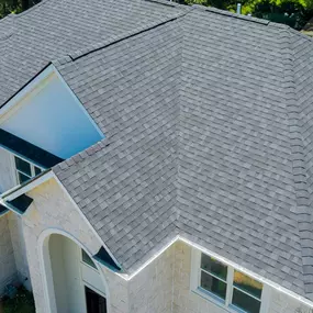 aerial view of newly installed roof on 2 story home