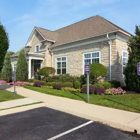 A house with a purple sign in front of it