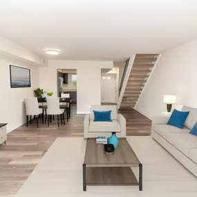 Living room with a couch and a coffee table and a television