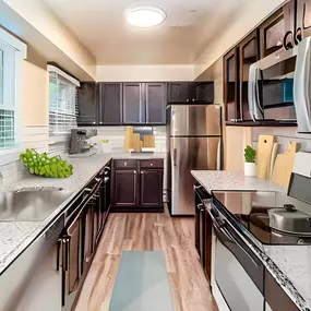 Kitchen with granite counter tops and stainless steel appliances
