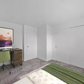 A bedroom with a bed, desk, and chair.