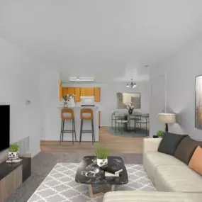 A living room with a white couch and a television on the left side.