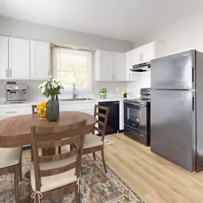 Kitchen with white cabinets and a stainless steel refrigerator