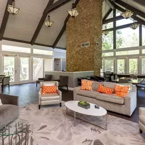 Living room with couches chairs and a coffee table