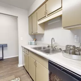 Kitchen with beige cabinets and stainless steel appliances