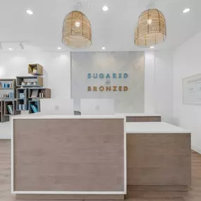 SUGARED + BRONZED Coral Gables Storefront reception desk