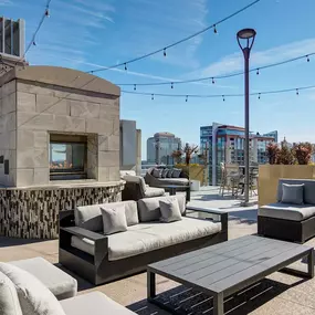 Outdoor fireplace with ample lounge seating.