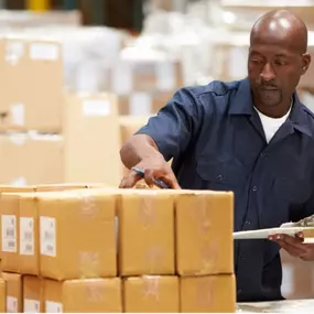 an Xcluder employee reviewing an order of rodent prevention products