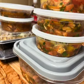 A variety of freshly prepared, chef-crafted meals packed and ready for delivery, showcasing Chef Joe’s personalized meal prep service. Neatly stacked containers reveal colorful, nutrient-rich dishes featuring fresh vegetables, herbs, and flavorful proteins. Designed for clients seeking healthy, convenient, and professionally prepared meals, this image reflects Chef Joe's commitment to making home dining both simple and satisfying throughout Phoenix, Arizona.